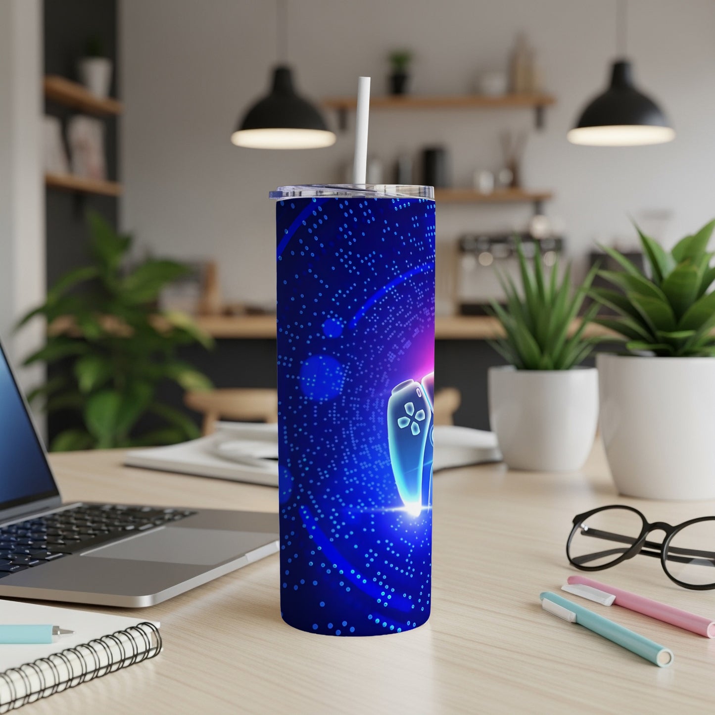 Blue tumbler with a glowing video game controller and circuit board pattern.