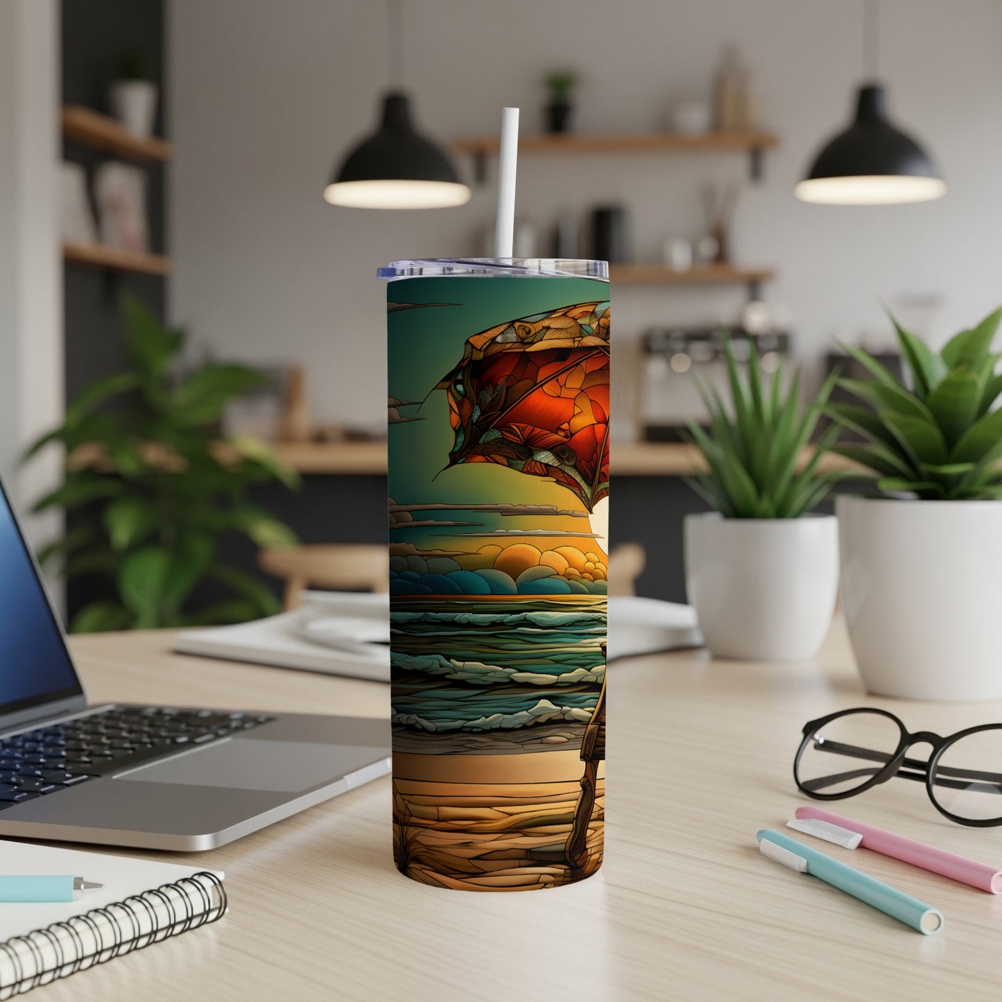 Tall tumbler with a colorful beach scene featuring a person and umbrella.
