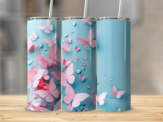 Blue tumbler with pink butterflies and floral accents.
