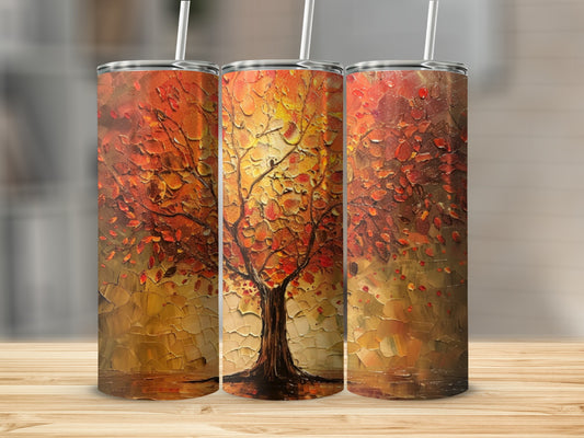Three tumblers featuring a textured painting of an autumn tree with warm orange and red leaves.
