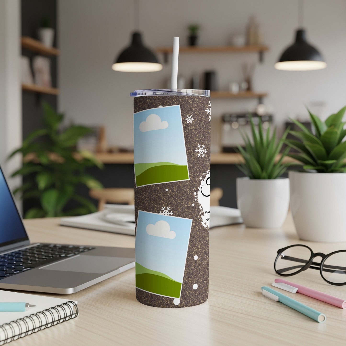 Brown tumbler with photos, snowflakes, and a snowman graphic, with a straw.