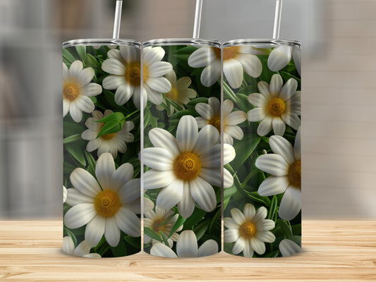 Three tumblers with a white daisy floral pattern on a wooden surface.