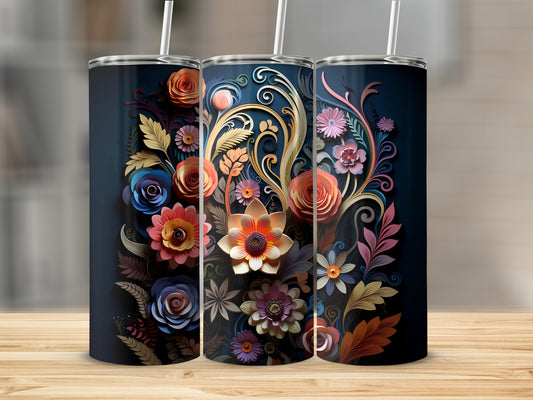 Three dark blue tumblers with colorful floral designs and straws.