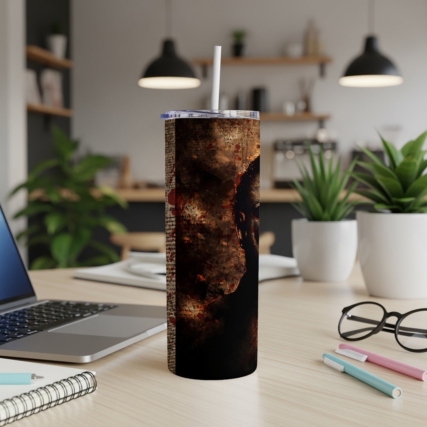 Tumbler with horror-themed art featuring a distressed face and blood splatters.