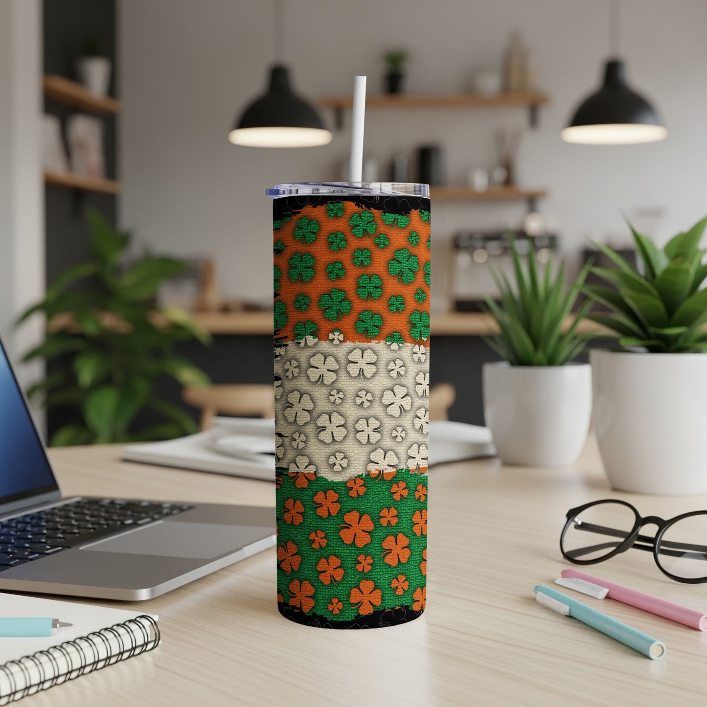 Green, beige, and orange St. Patrick's Day clover pattern tumbler with straw.