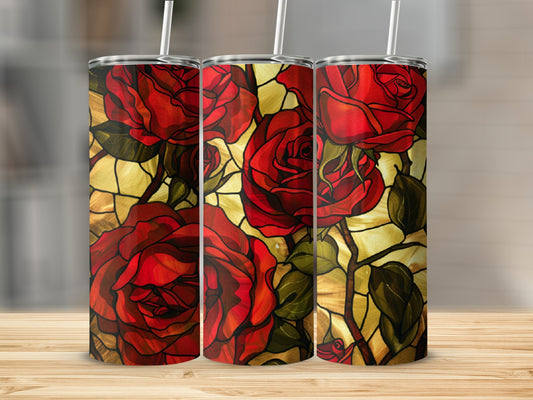 Three tumblers with a stained-glass red rose design sit on a wooden surface.
