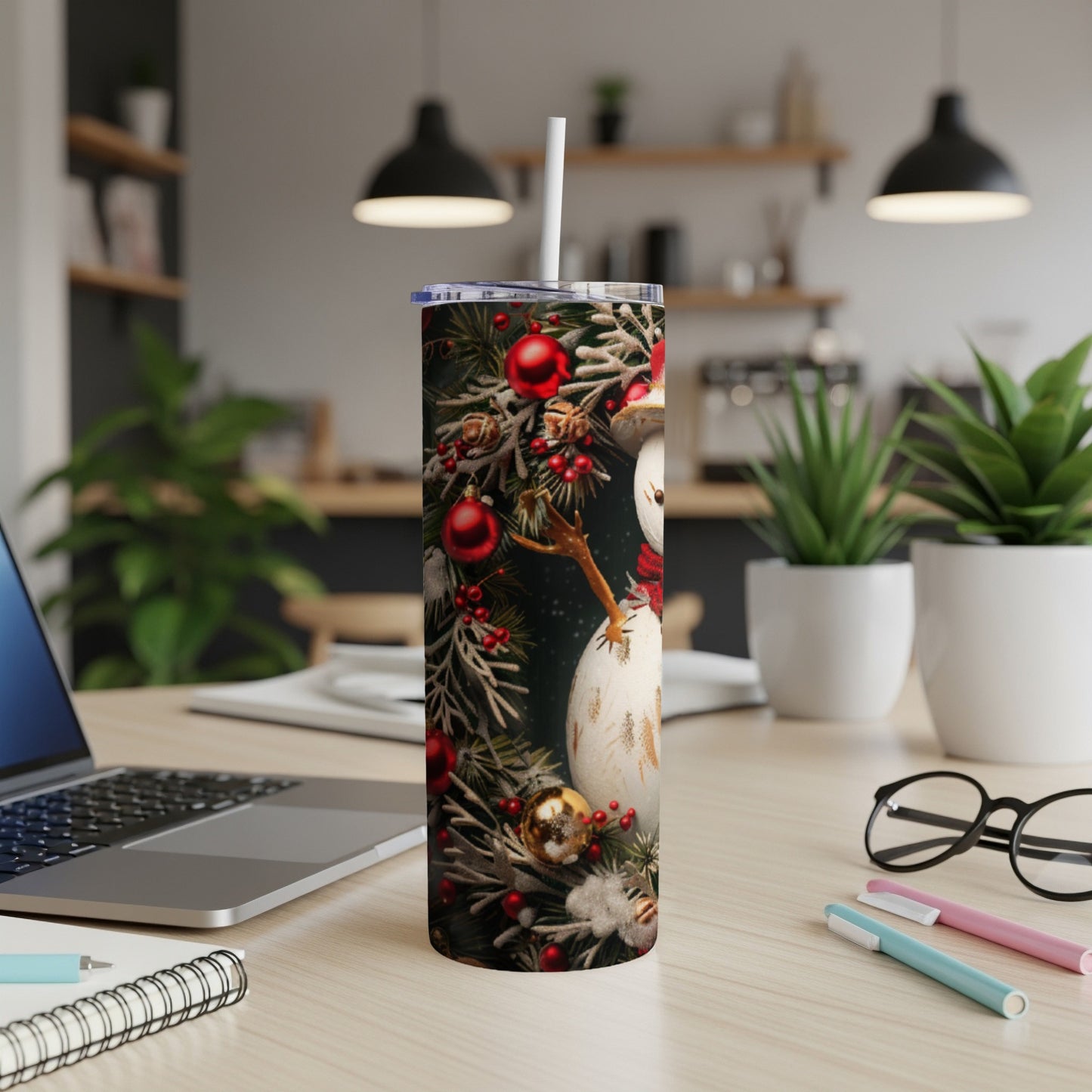 Snowman with festive Christmas ornaments on a skinny tumbler.