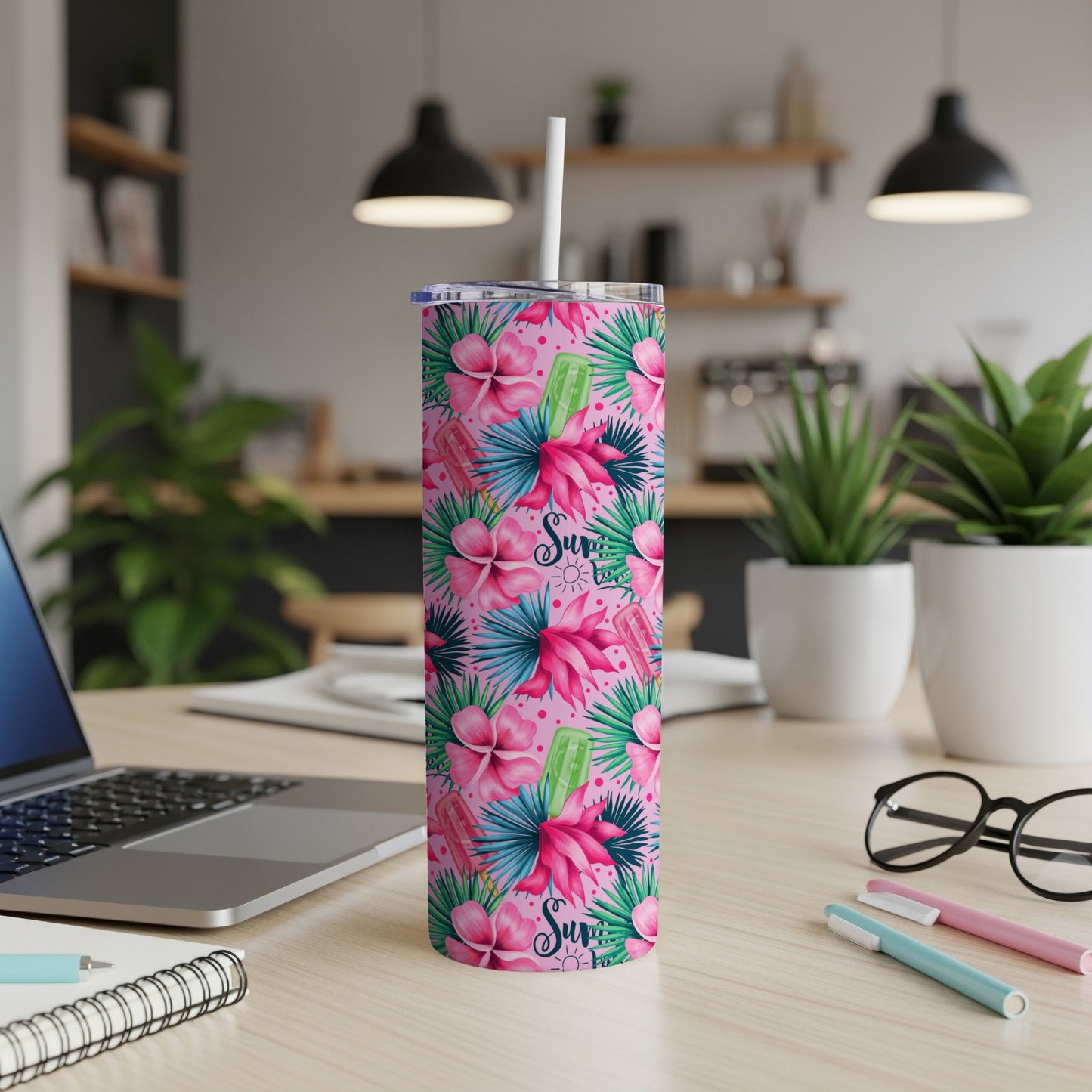 Pink floral tumbler with flamingo and popsicle design, "Surf's Up" text.