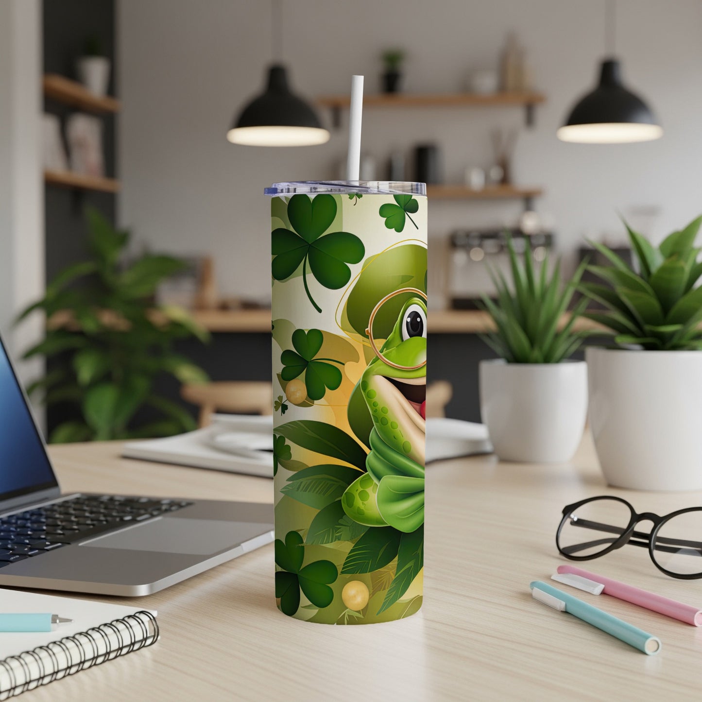 Green cartoon frog wearing glasses and a bow tie on a St. Patrick's Day tumbler.