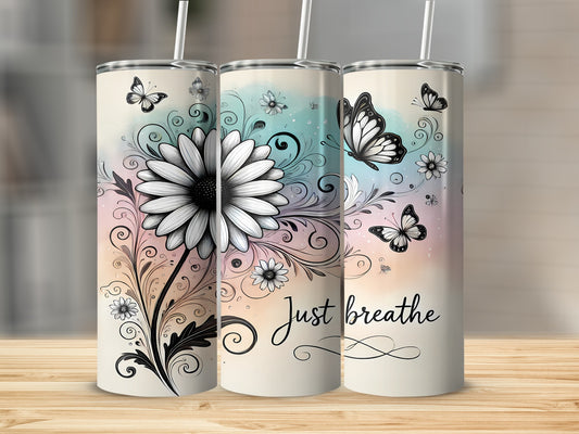 Three tumblers with a floral and butterfly design, one says "Just breathe".