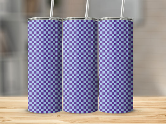 Three purple and blue checkered tumblers with straws on a wooden surface.