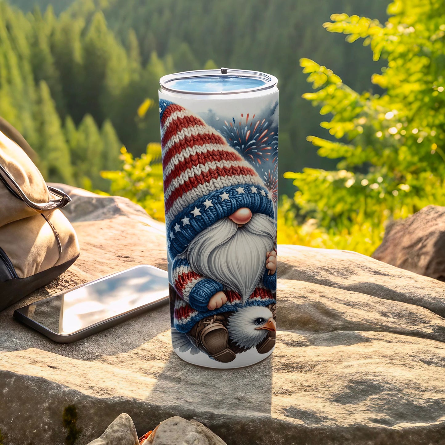 Gnome with American flag hat and sweater holding an eagle, on a rocky surface.