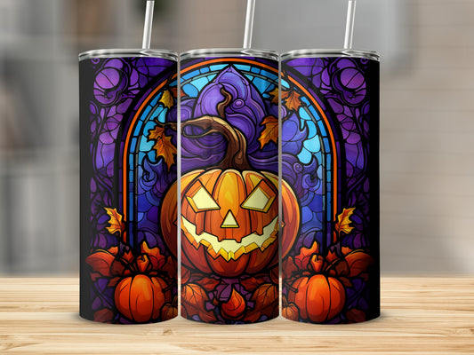 Jack-o'-lantern with stained glass, pumpkins, and autumn leaves design on tumbler.