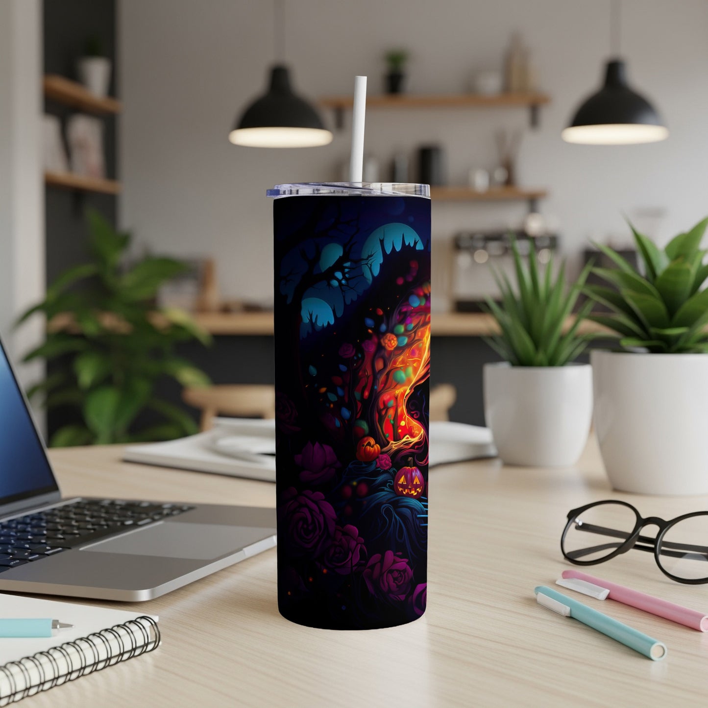 Black tumbler with colorful Halloween art featuring pumpkins, roses, and spooky trees.