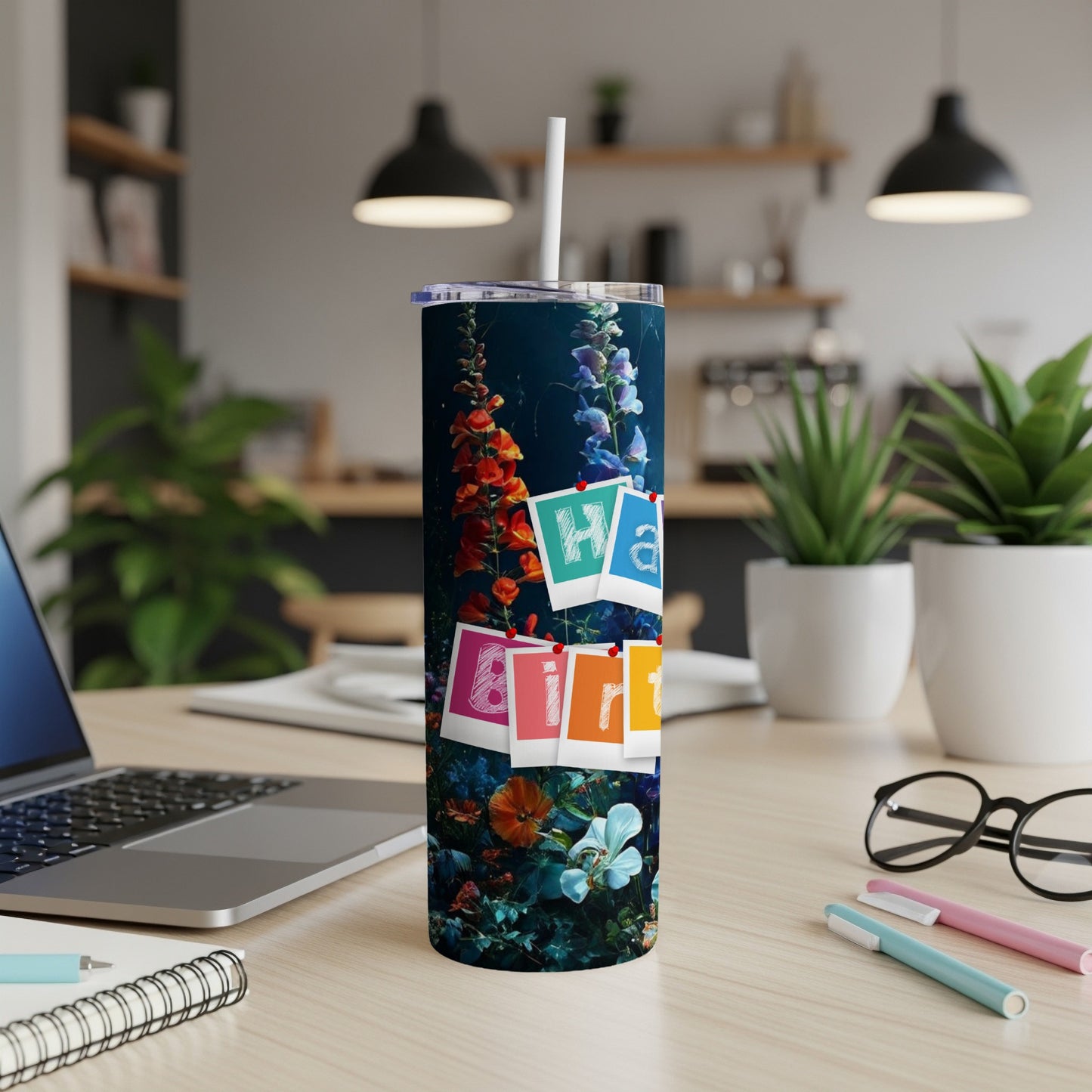 Tall tumbler with colorful floral design and "WA" spelled out with letter tiles.