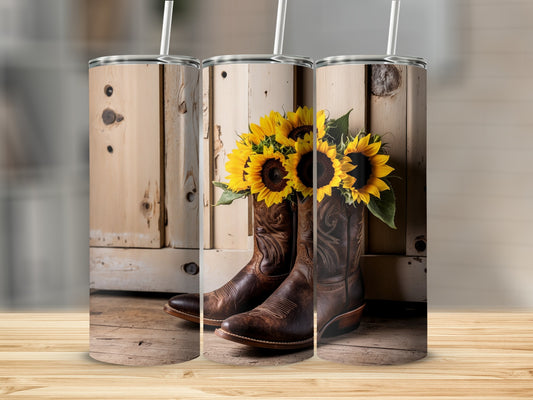 Cowboy boots and sunflowers arranged in front of wooden planks.