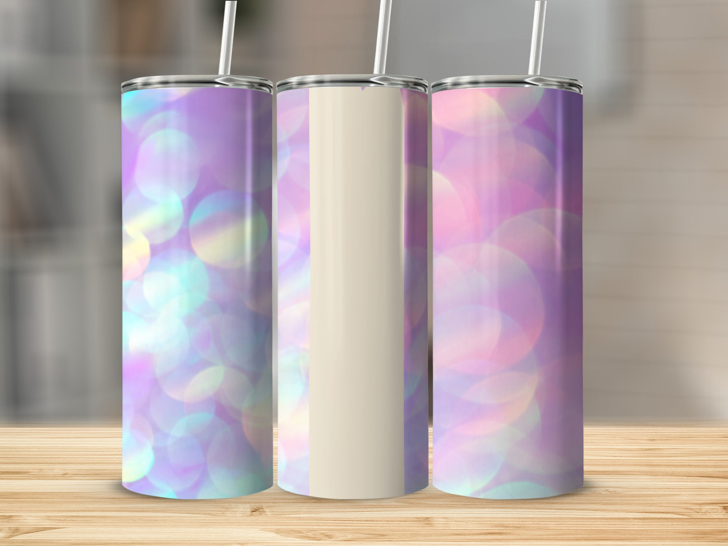 Three tumblers with a purple, pink, and yellow bokeh background.
