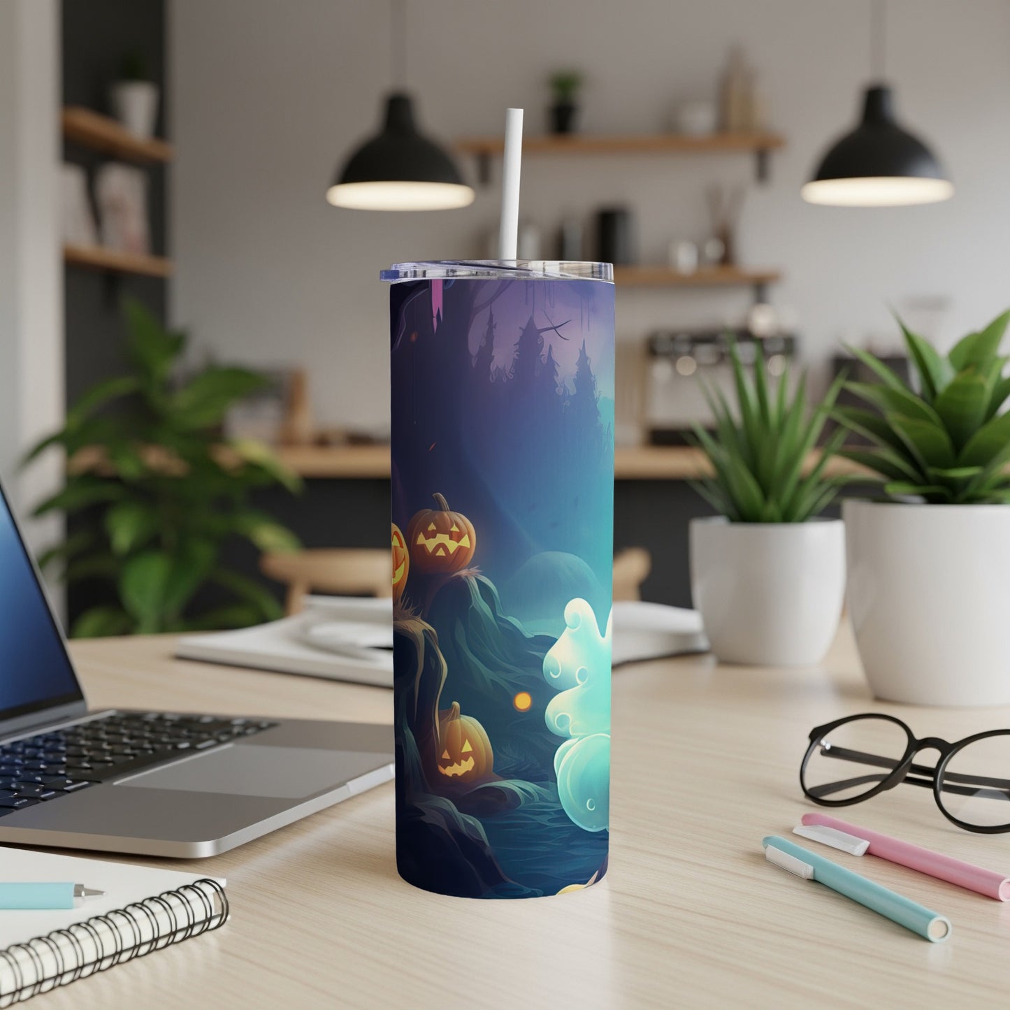Tumbler with Halloween theme featuring jack-o'-lanterns, spooky trees, and glowing orbs.