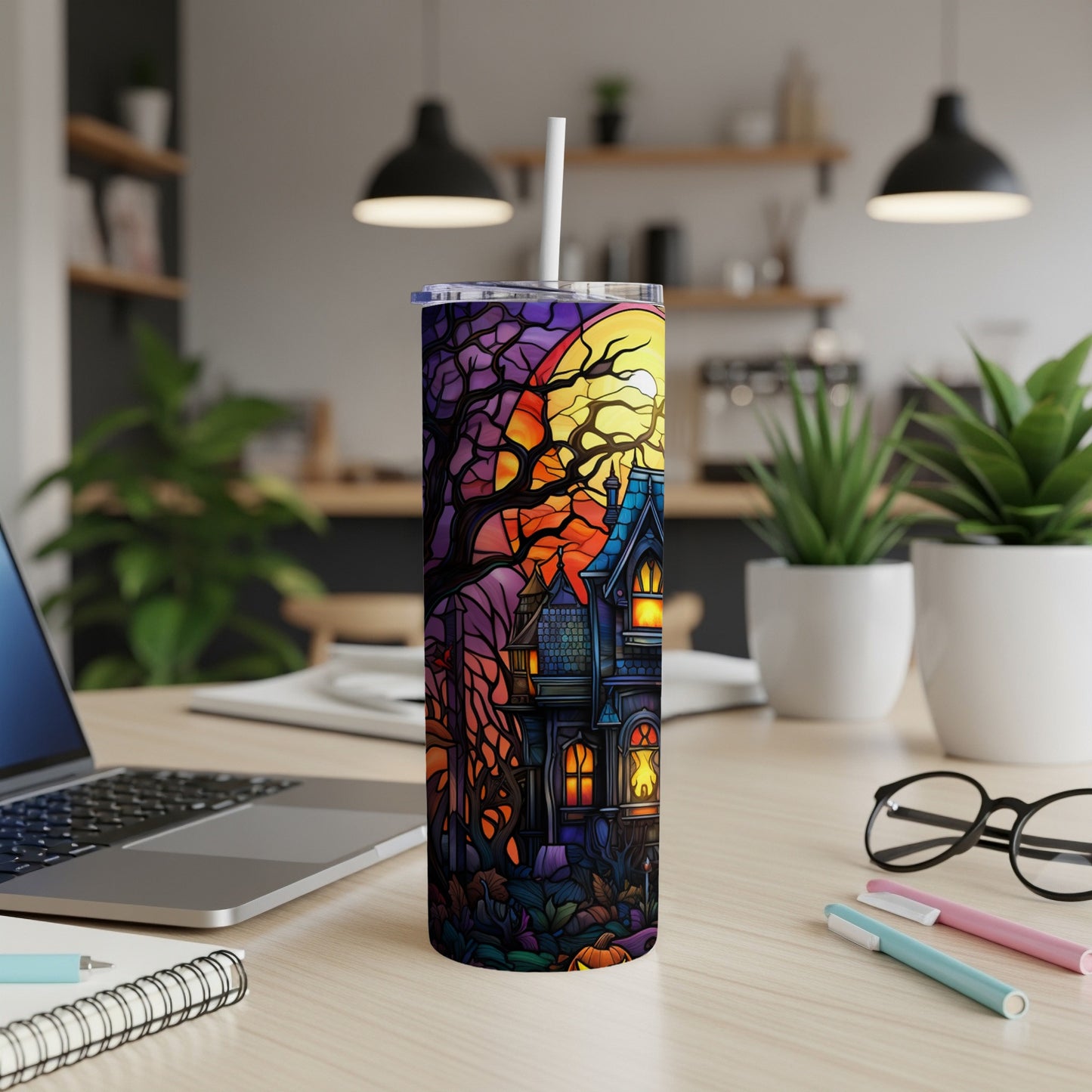 Spooky haunted house with moon and trees on a purple gradient tumbler.