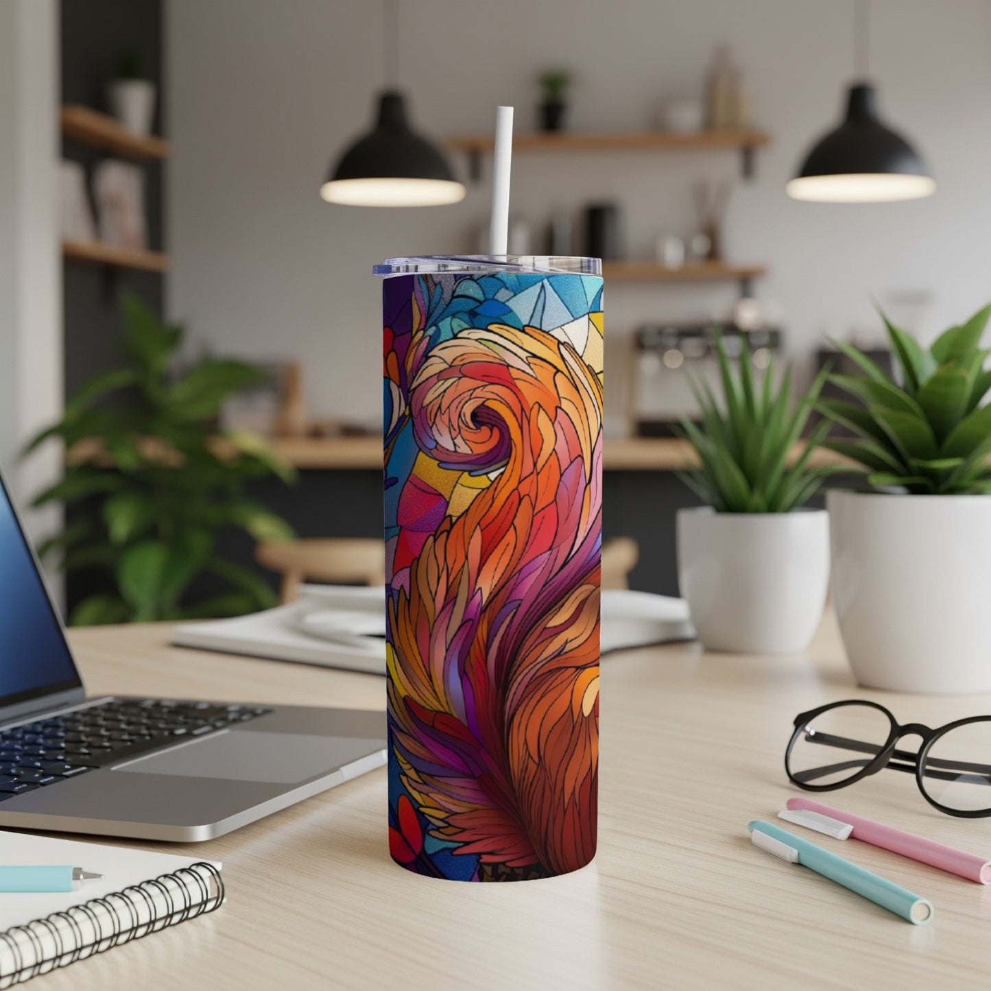 Colorful stained-glass pattern on a tall, slender tumbler with a straw.