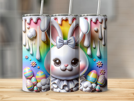 Easter bunny tumbler with colorful eggs and dripping paint design.
