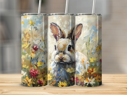Three tumblers featuring a painterly rabbit surrounded by colorful wildflowers.