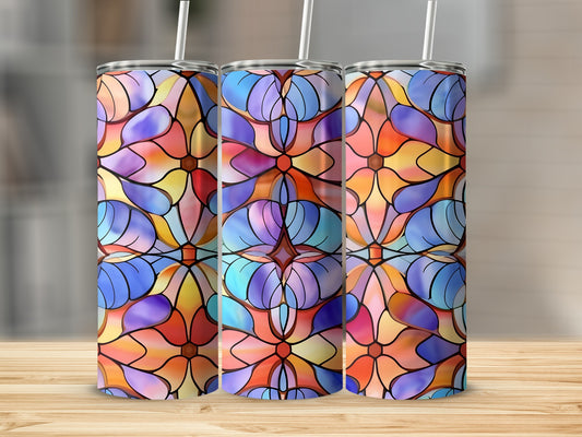 Three tumblers with colorful stained glass floral patterns on a wooden surface.