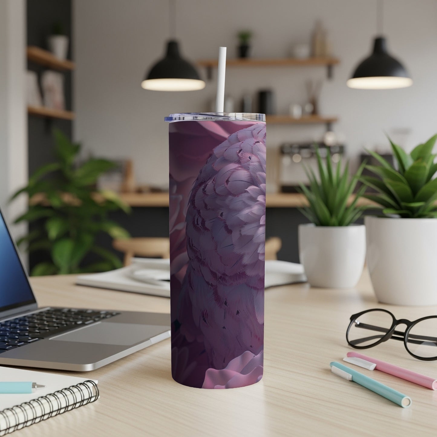 Purple feather pattern on a stainless steel tumbler with a straw.