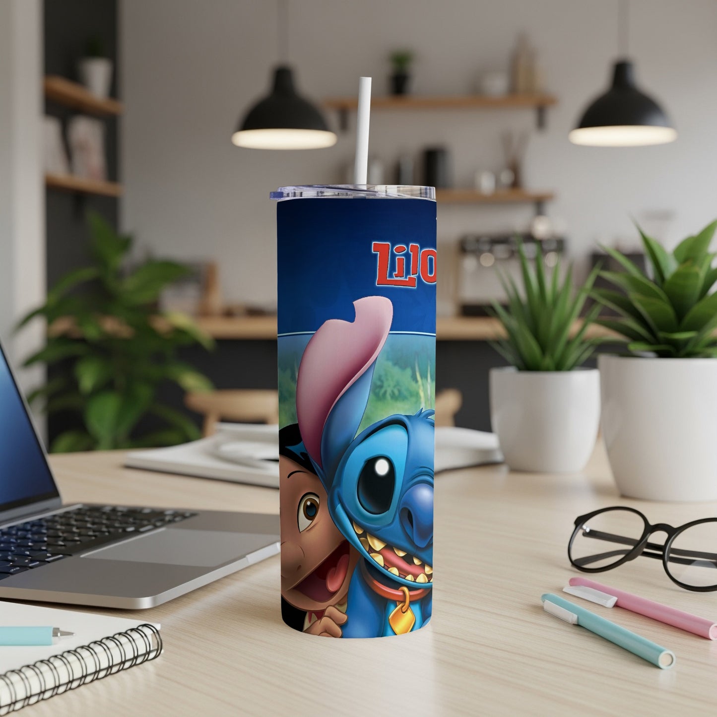 Lilo and Stitch characters smiling on a blue tumbler with a straw.