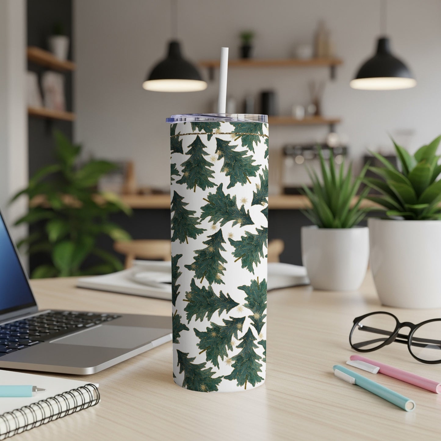 Green and white Christmas tree pattern tumbler with gold accents.