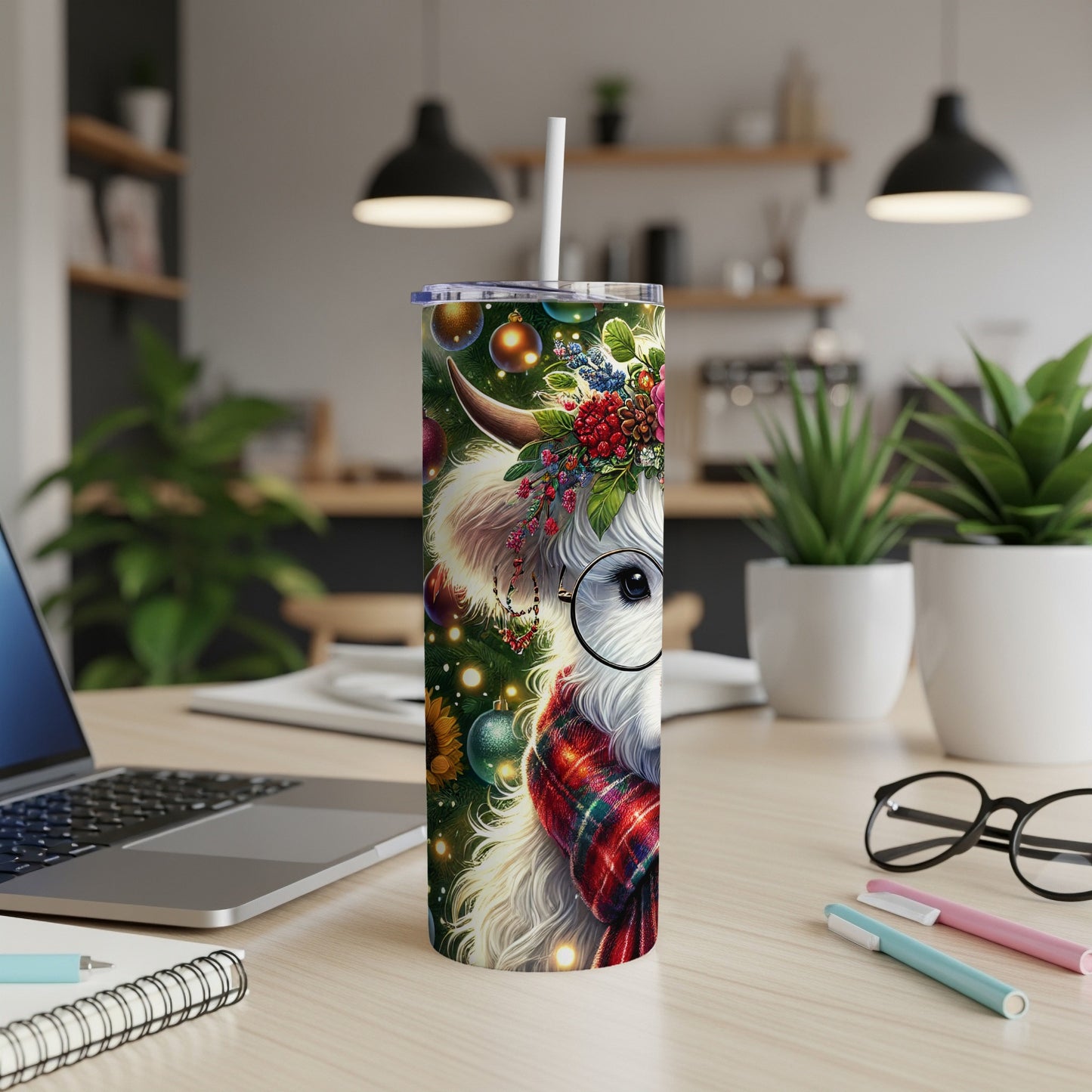 White Highland cow with festive wreath and plaid scarf on a tumbler.