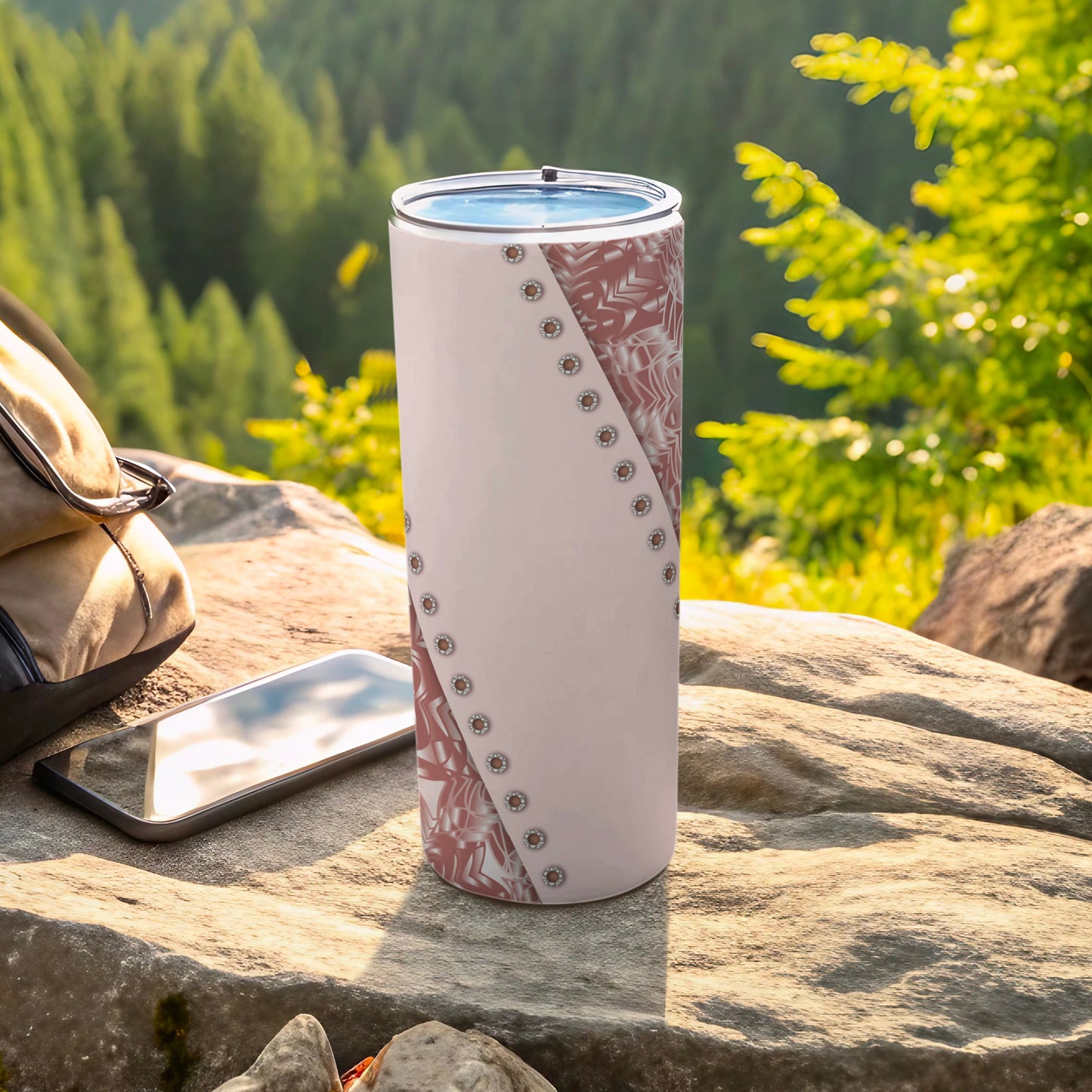 White tumbler with brown floral pattern and silver stud accents on rocks.