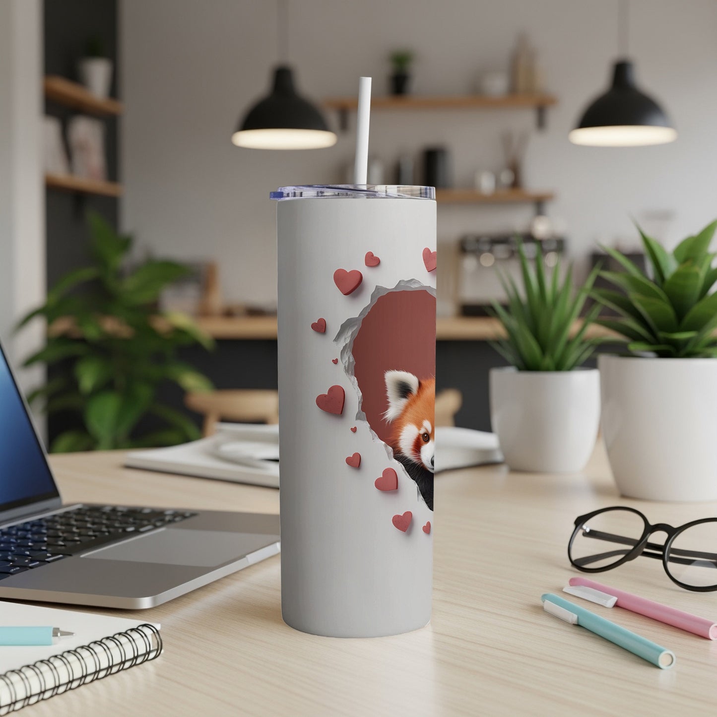 White tumbler with red panda illustration and falling hearts.