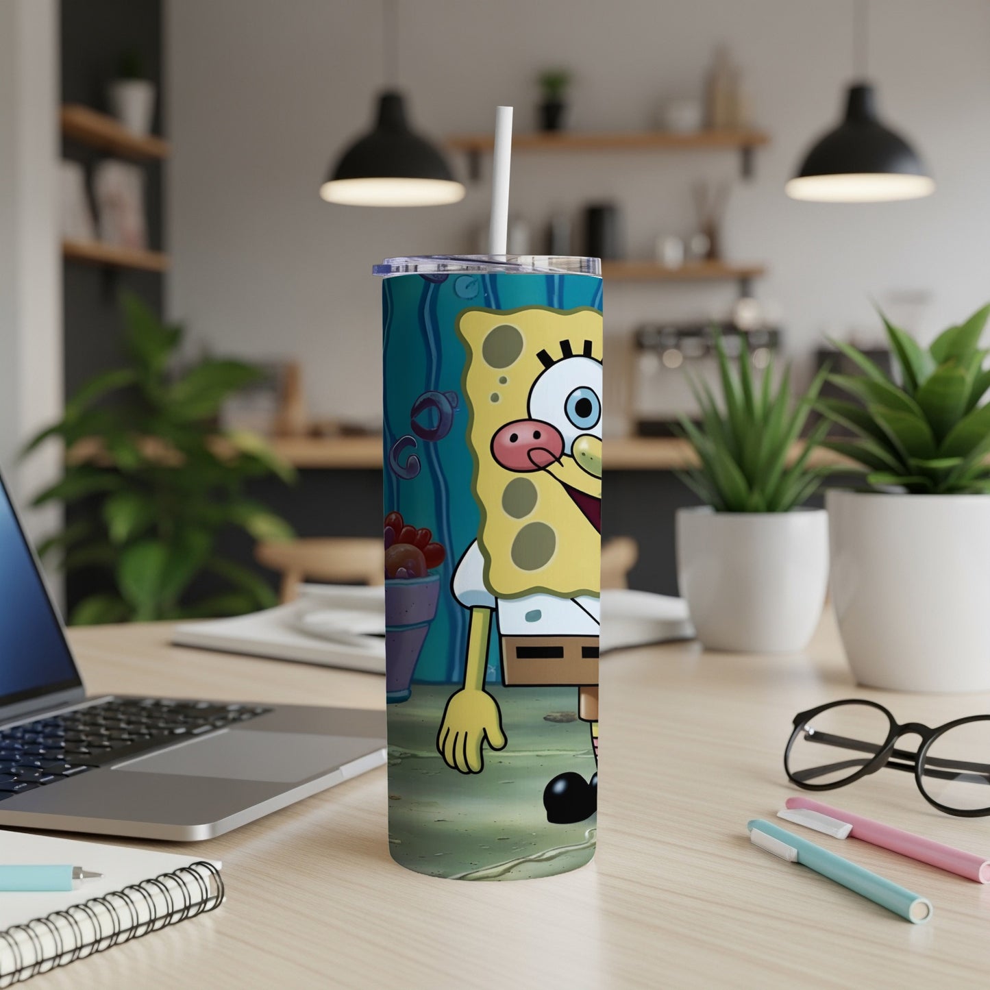 SpongeBob SquarePants character on a blue speckled tumbler with a white straw.