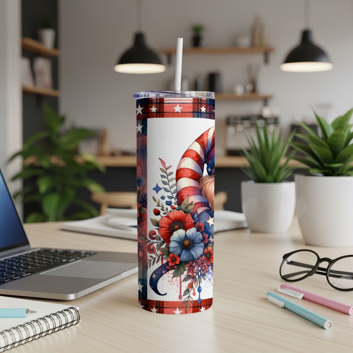 Red, white, and blue gnome tumbler with floral accents and plaid lid.