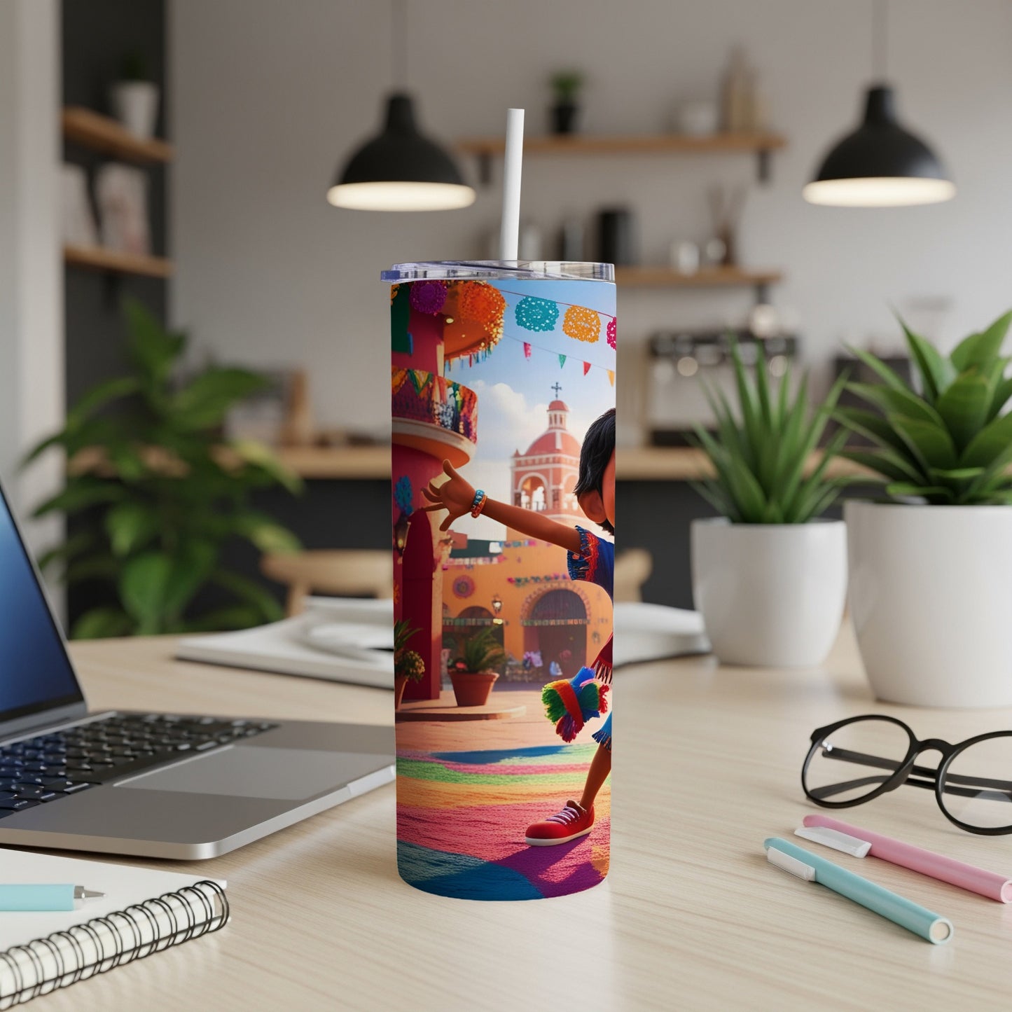 Colorful tumbler with cartoon girl and festive decor on a desk.