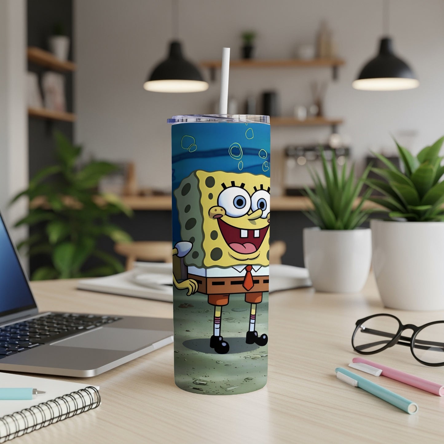 SpongeBob SquarePants on a skinny tumbler with a white straw.