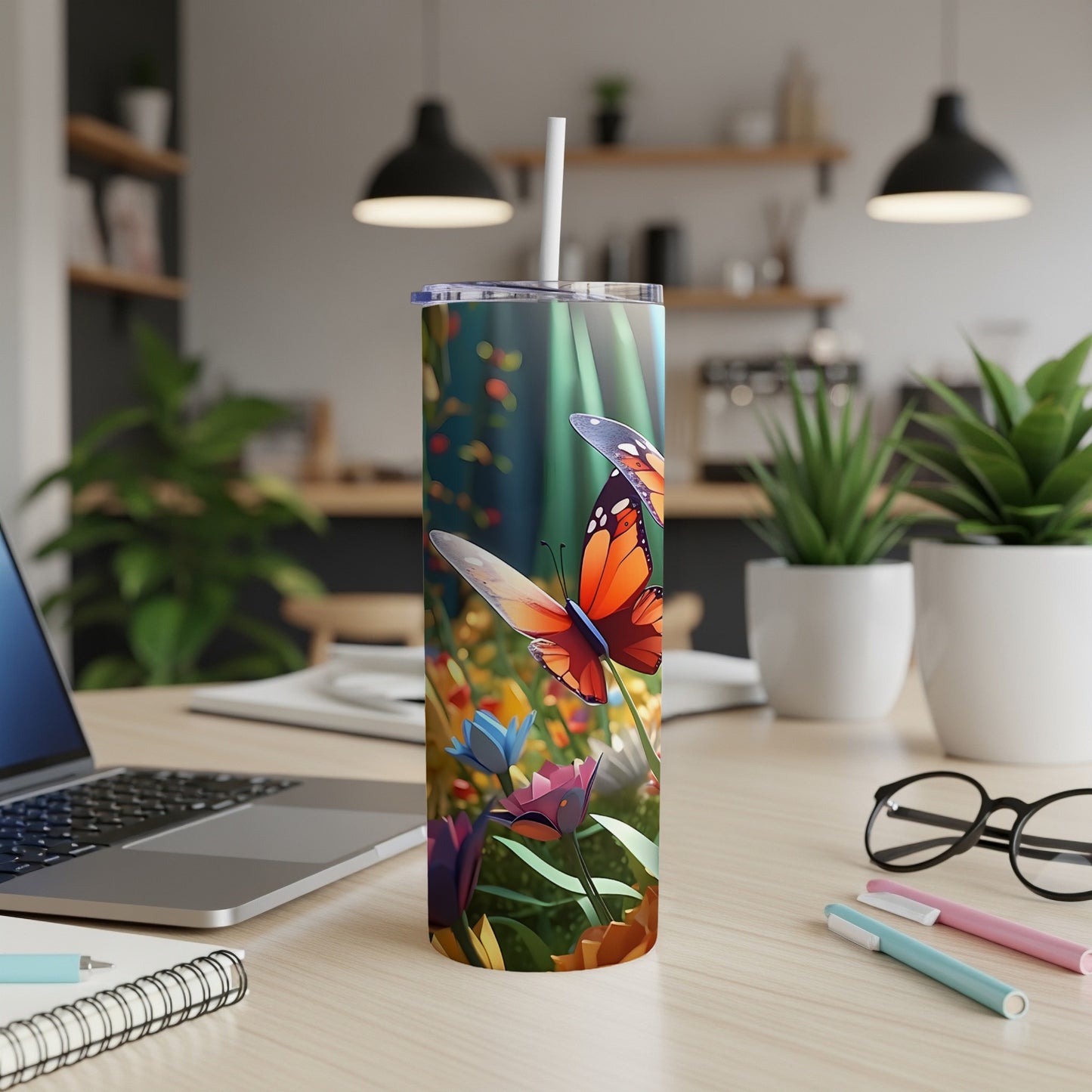 Tall tumbler with butterflies and colorful flowers in a garden scene.