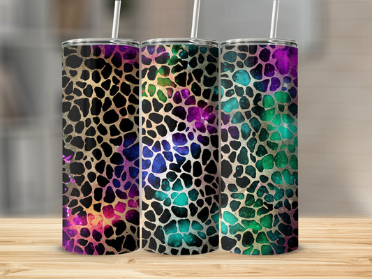 Three tumblers with a colorful galaxy giraffe print pattern.