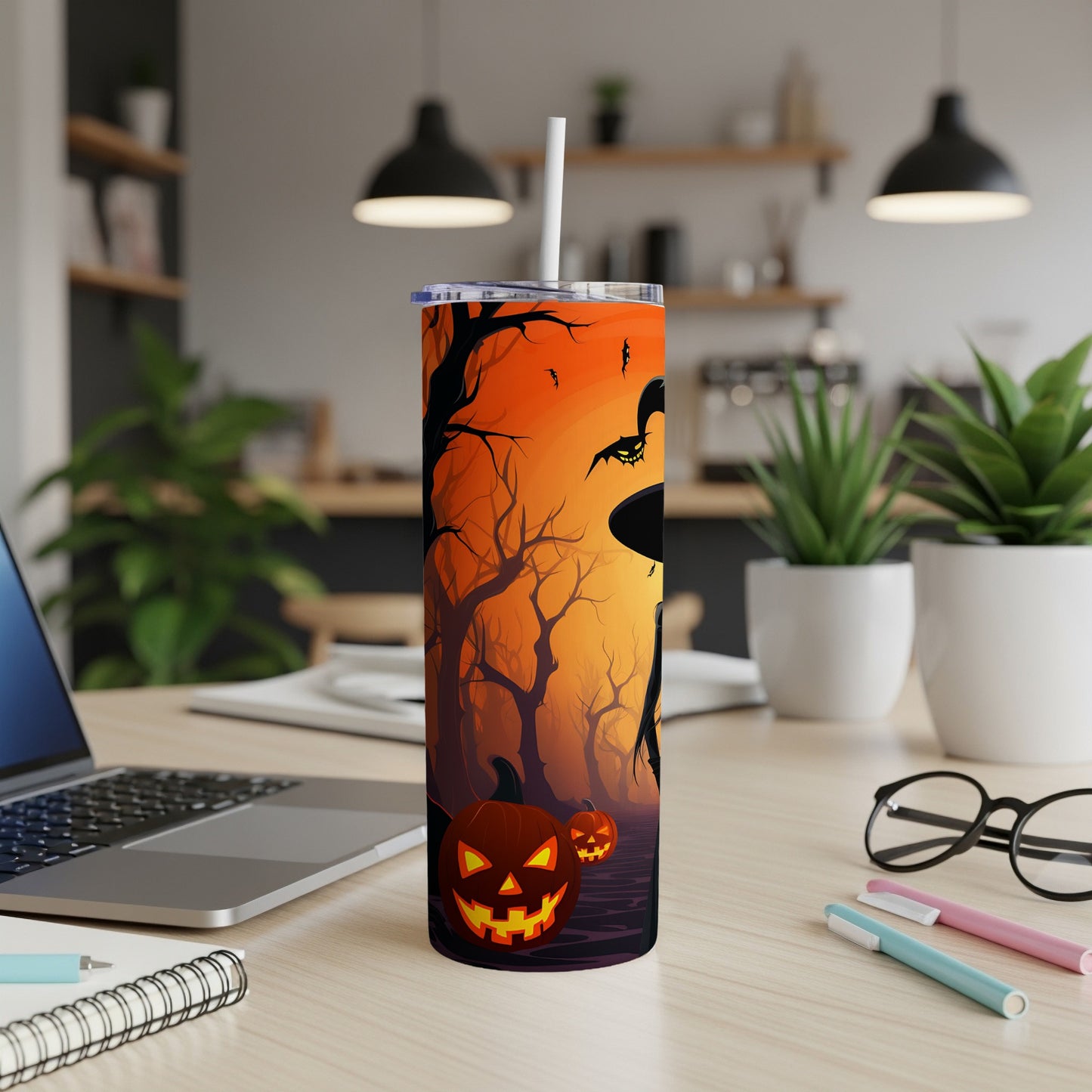 Halloween tumbler with witch, bats, and jack-o'-lanterns on an orange forest background.