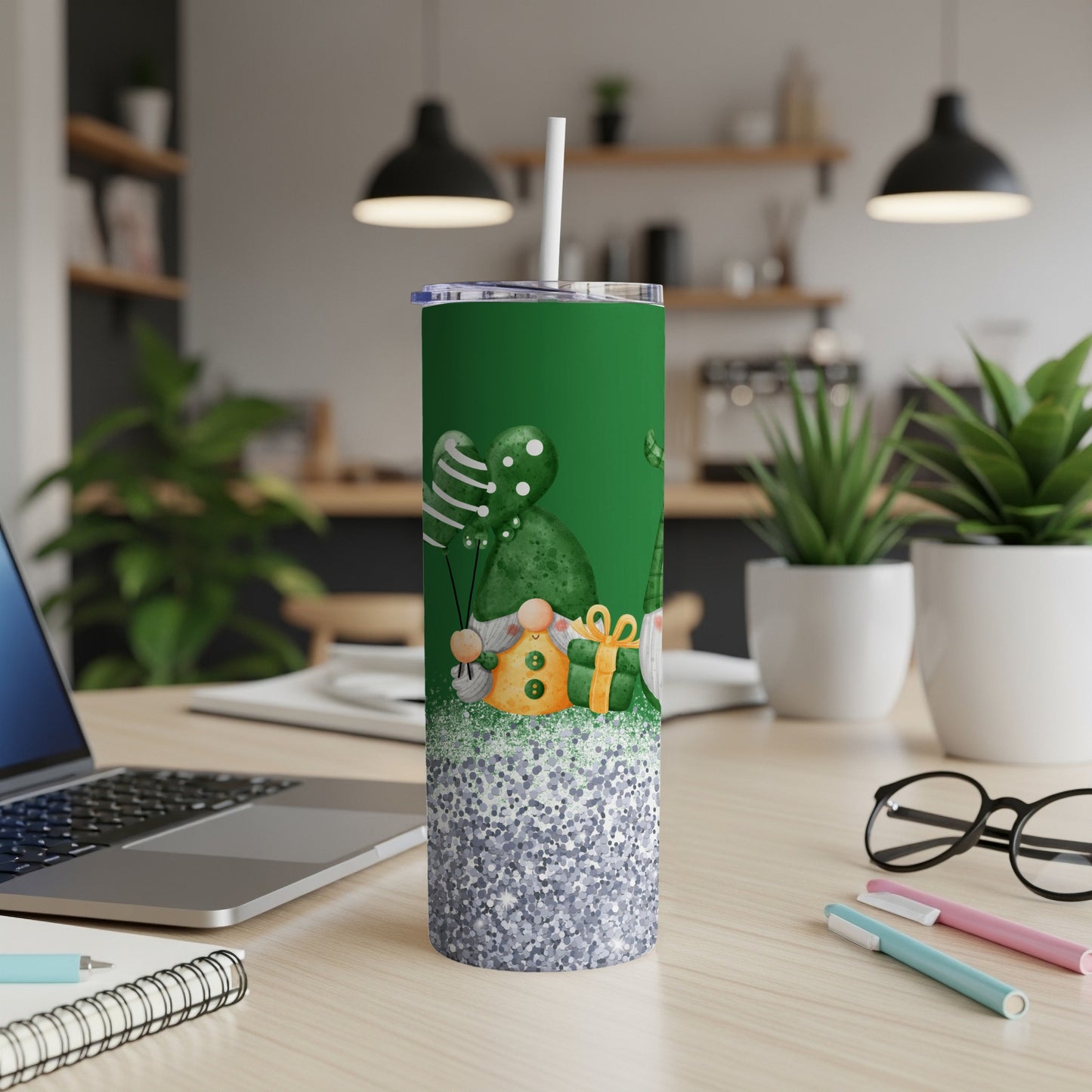 Green tumbler with gnomes, balloons, and glitter pattern.