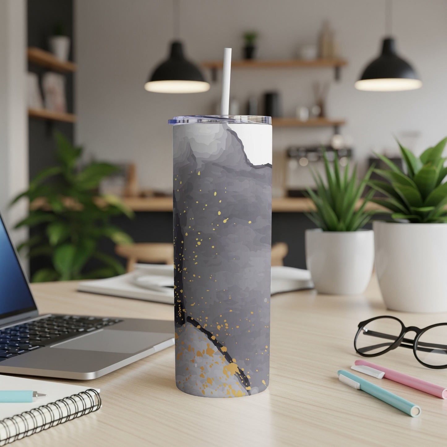 Tumbler with gray, white, and gold abstract watercolor design.