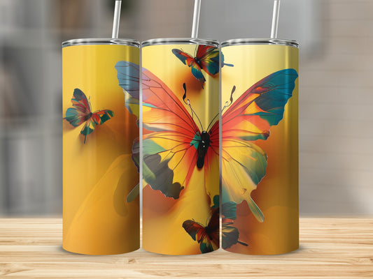 Three tumblers featuring a vibrant butterfly design on a yellow gradient background.