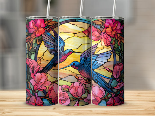 Two hummingbirds in stained glass style with floral accents on a tumbler.