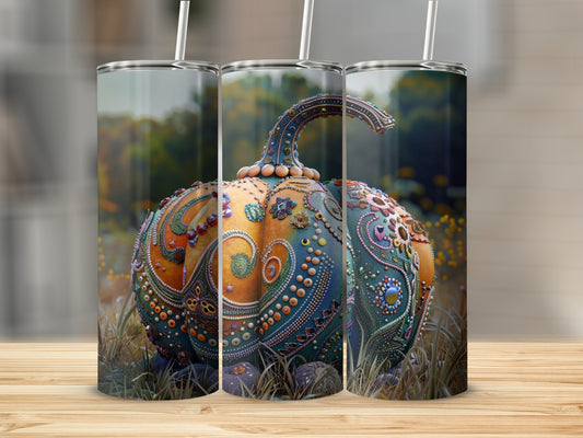 Triptych of a decorative pumpkin tumbler with intricate beadwork in a field.