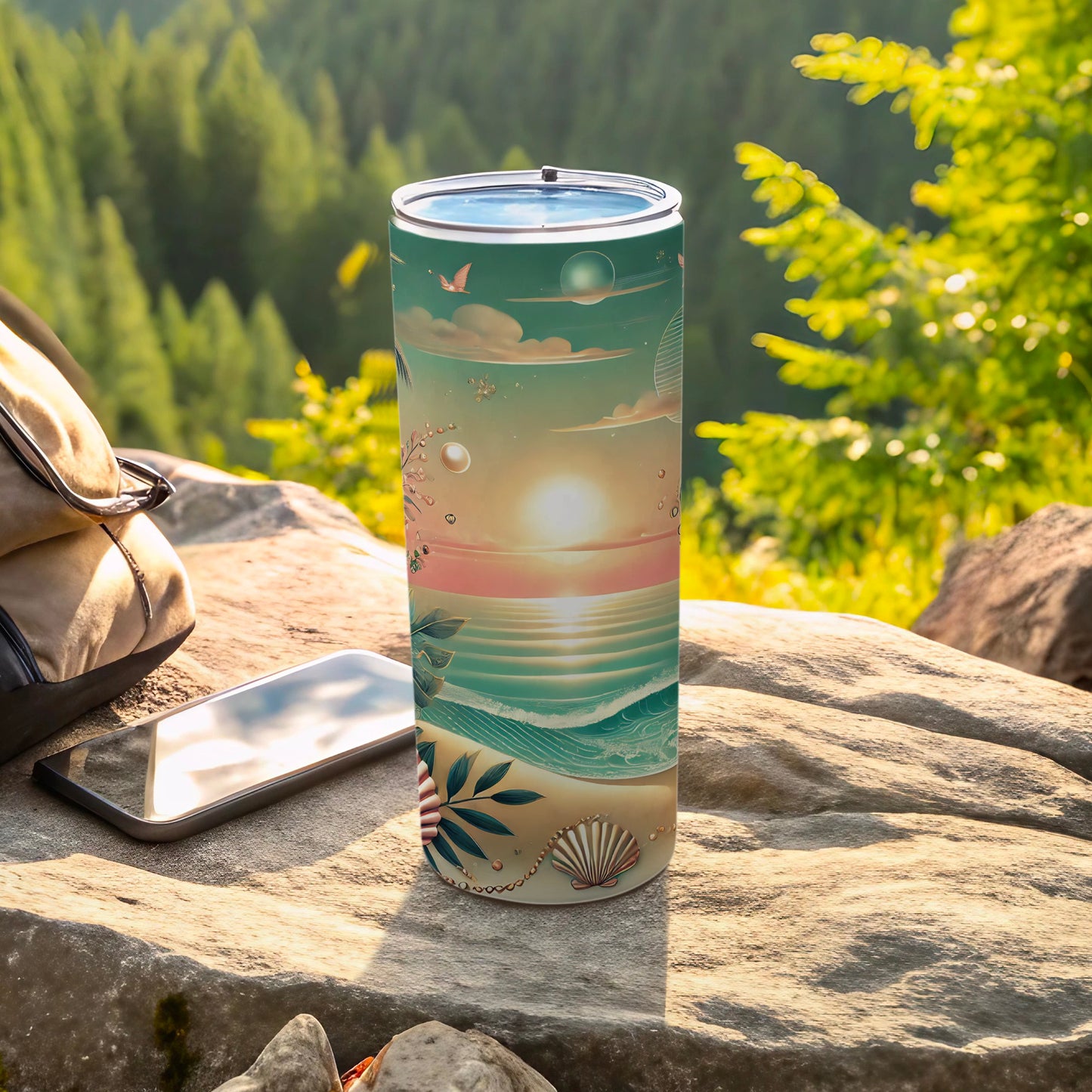 Tall tumbler with a beach sunset design on a rock.