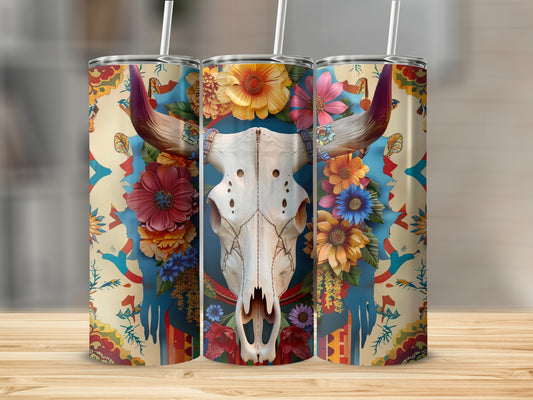 Floral bull skull tumbler with colorful patterned background.