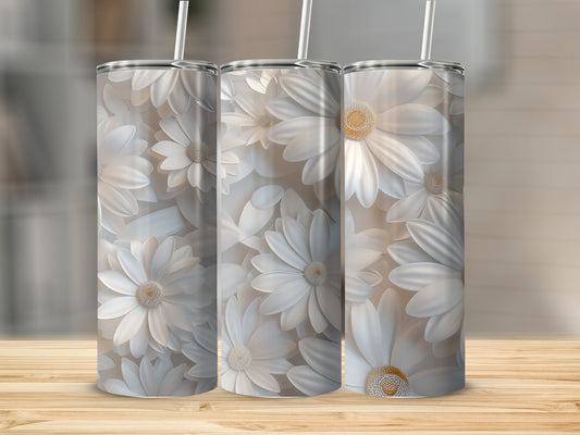 Three white daisy tumblers with straw on wooden surface.