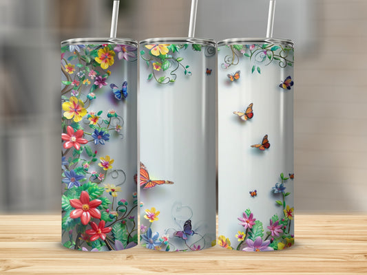 Three tumblers with floral and butterfly designs in a light background.