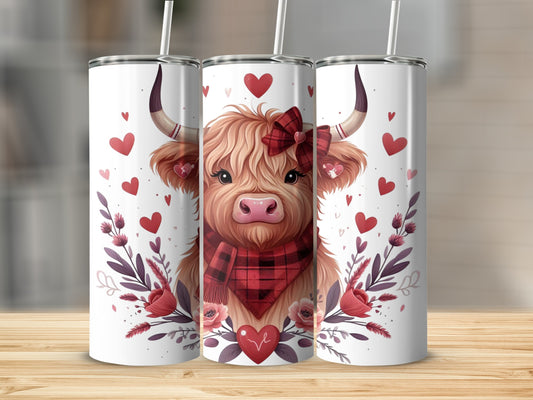 Highland cow with hearts and flowers on a tumbler.
